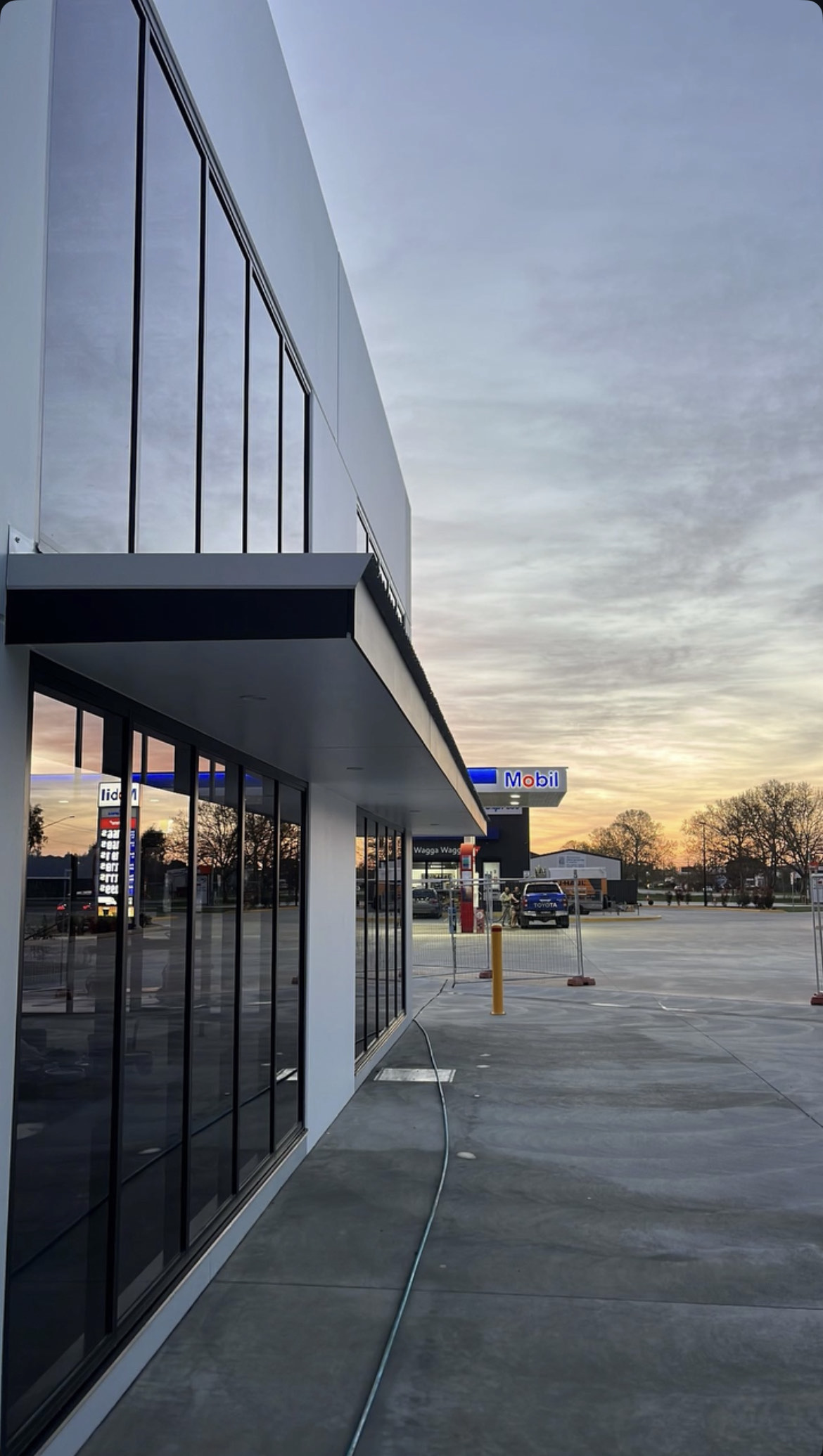 Commercial building exterior at sunset